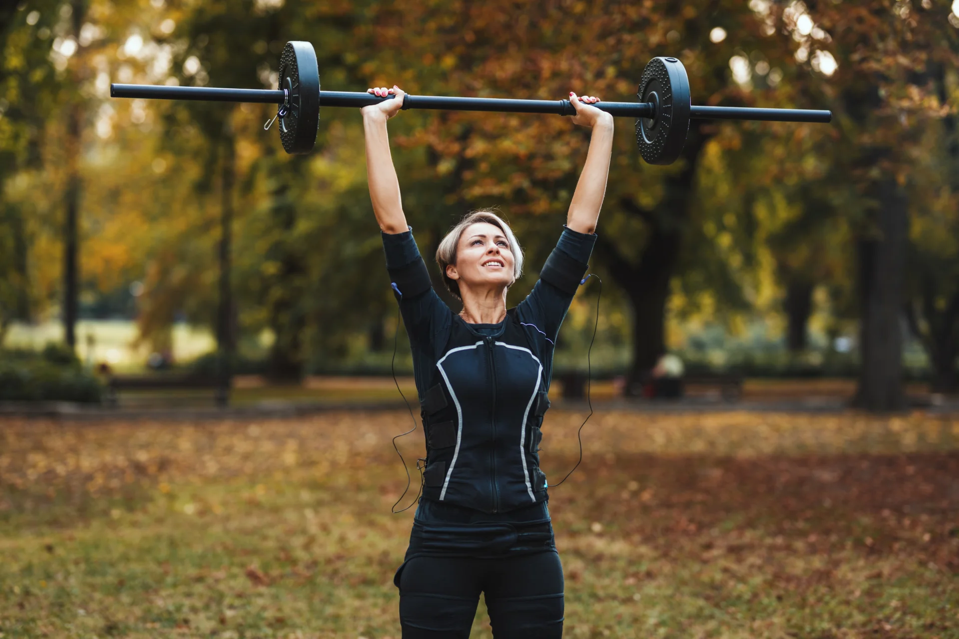 woman doing weightlifting in outdoor park area 2026 03 25 22 28 17 utc